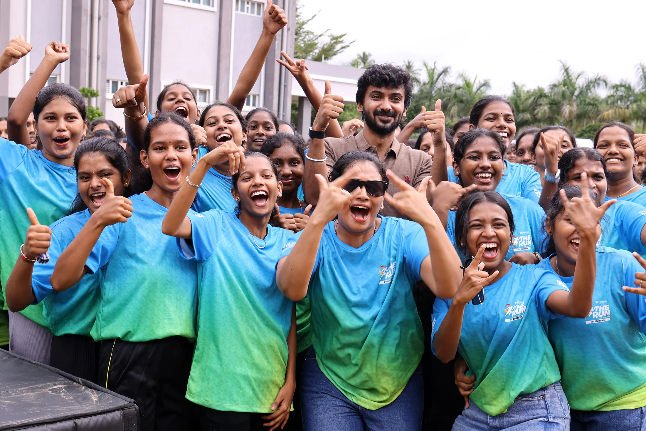 A group of third-edition runners cheering together after the event.