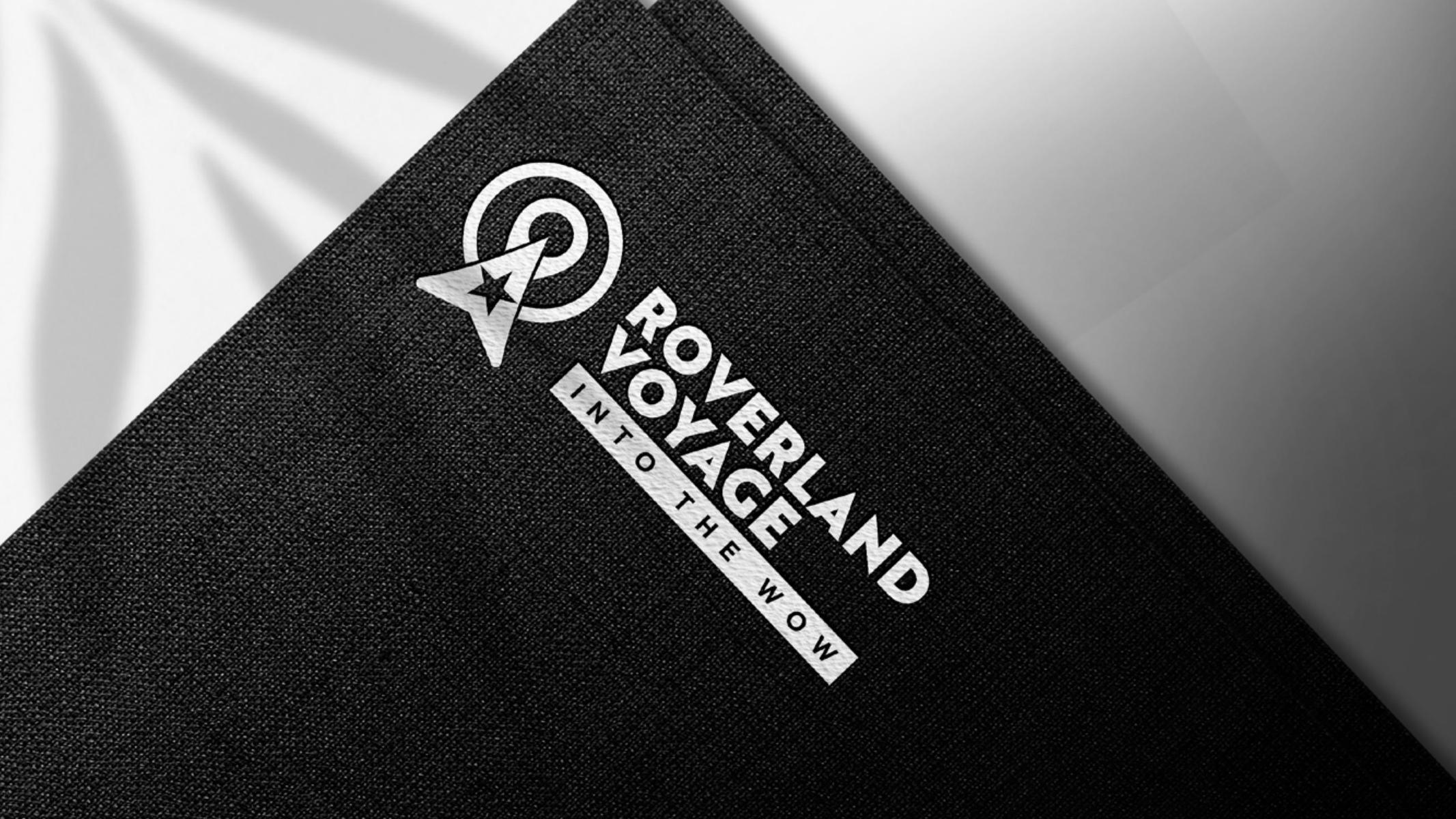 White Roverland Voyage logo on dark textured fabric